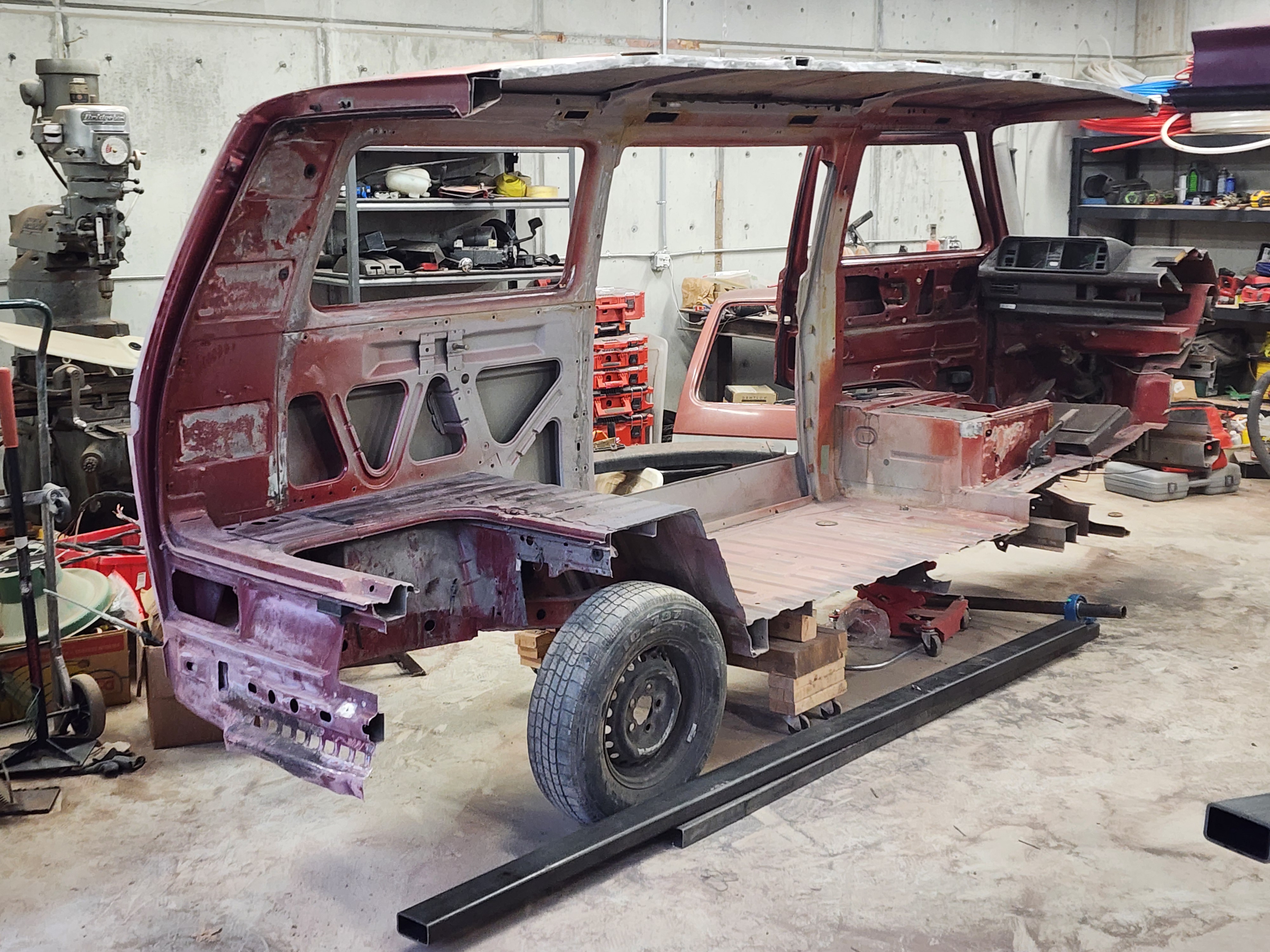 Body stripped and cut down before the chop — every panel saved for the customization build