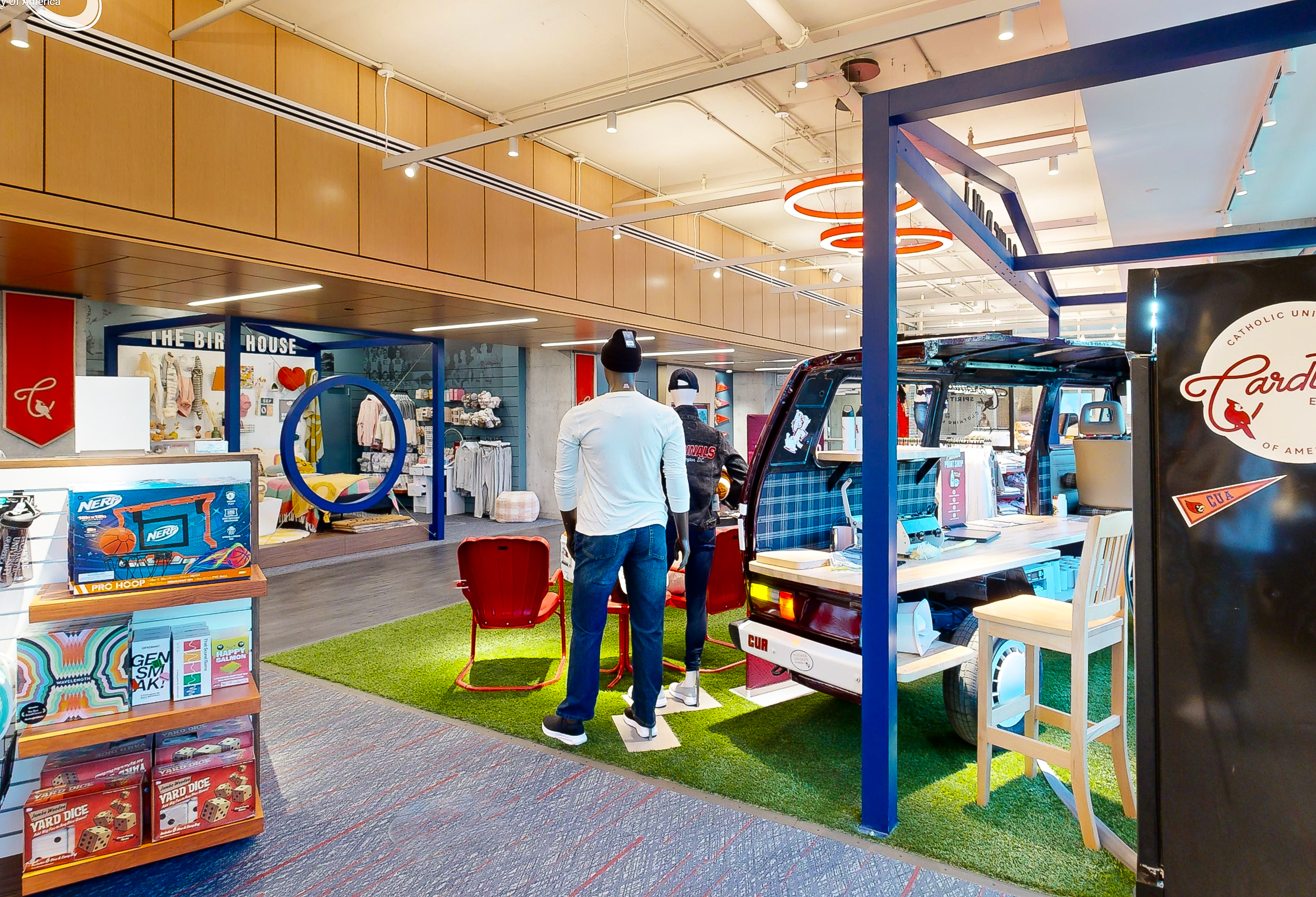 The chopped vintage van reborn as the in-store custom print shop, parked on game-day turf