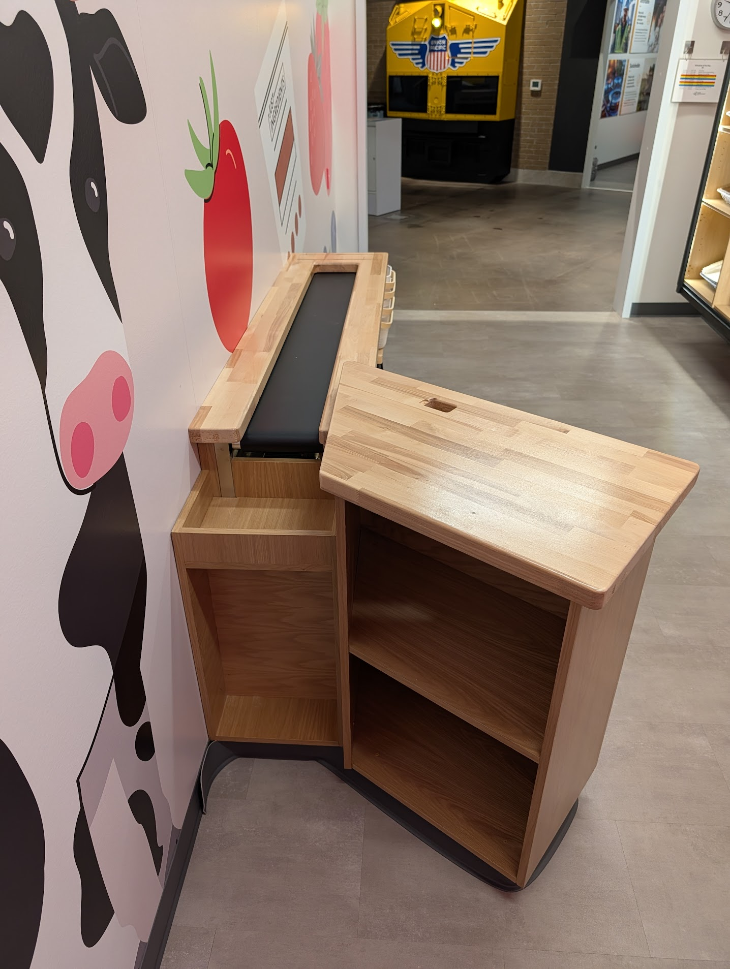 Custom checkout counter with illuminated arch detail