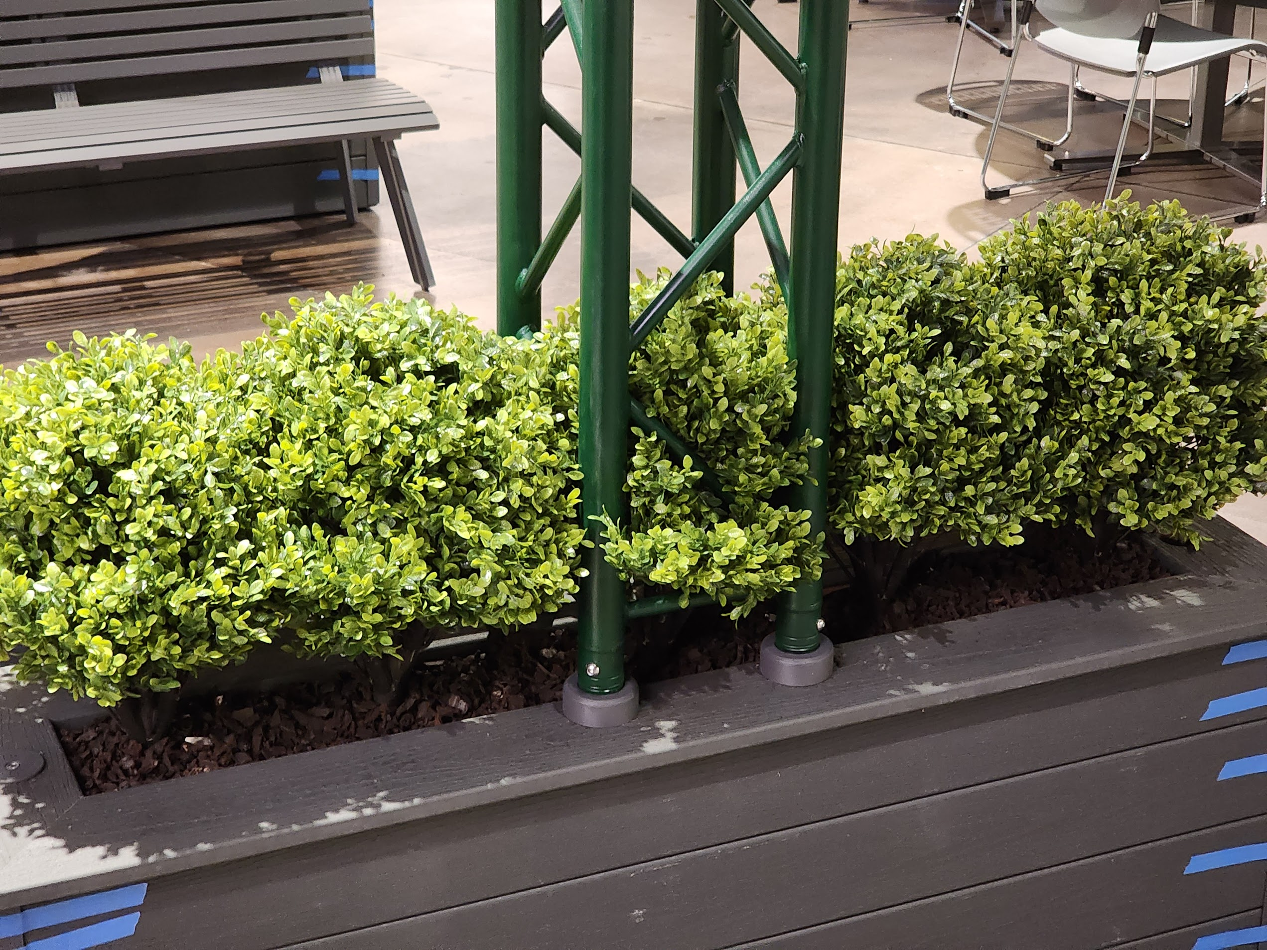 Detail: the truss legs anchor into the composite planters on glide casters