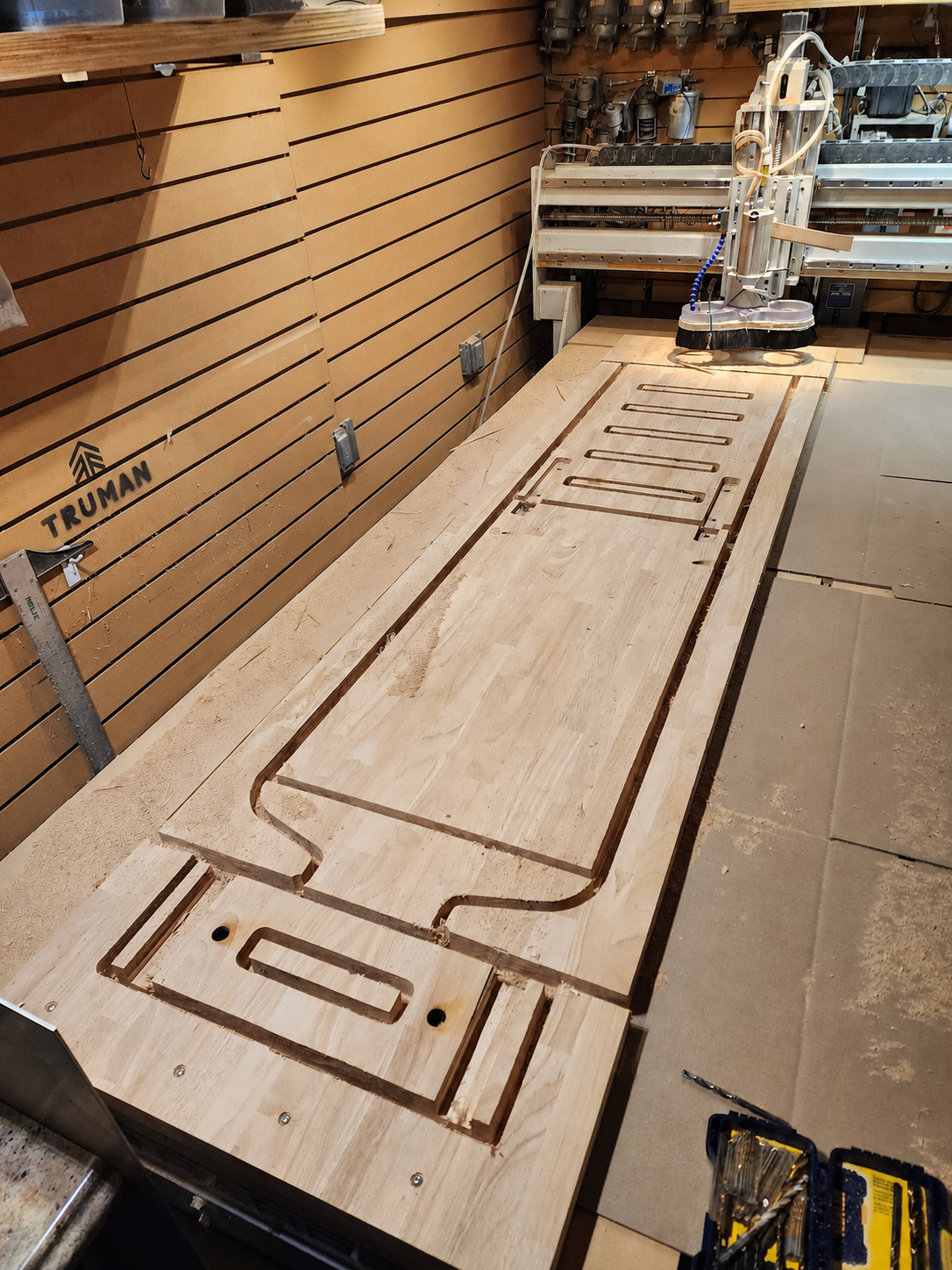 The counter casework laid out on the CNC bed in Truman’s own shop
