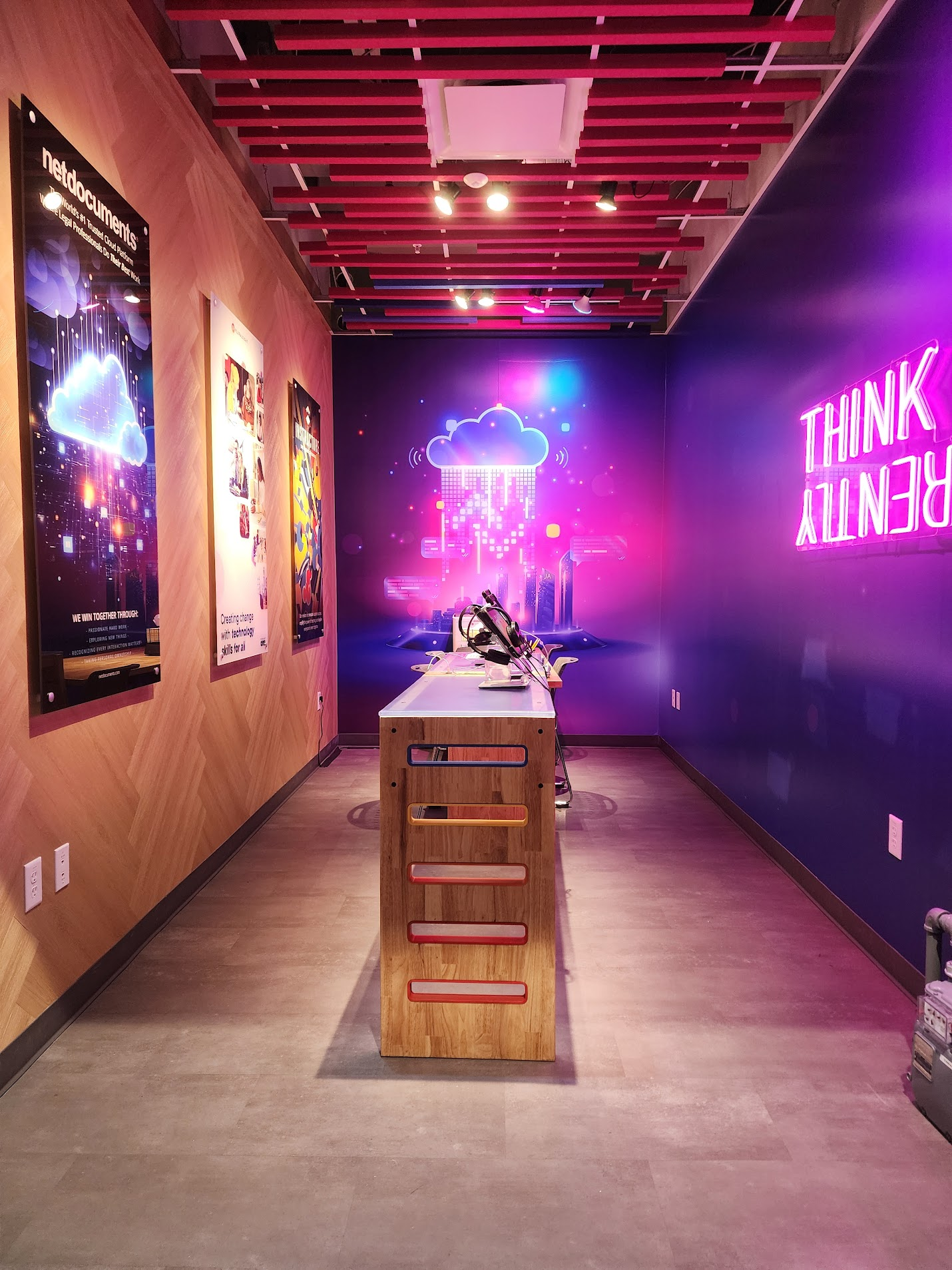 Color-coded workstation counter framed by the glowing cloud-city mural